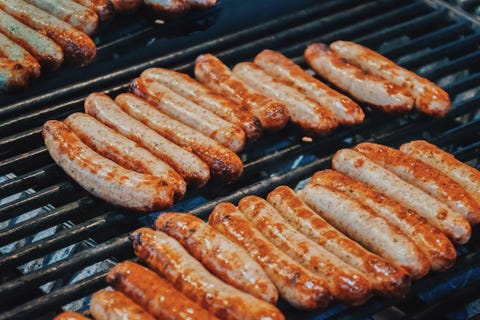 A shot of sausages on a bbq