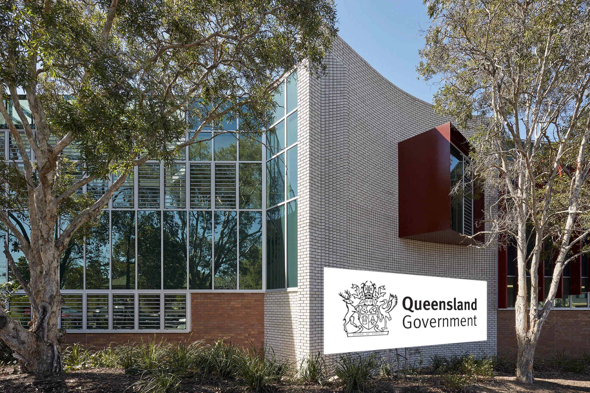 A picture of the college with a queensland government icon